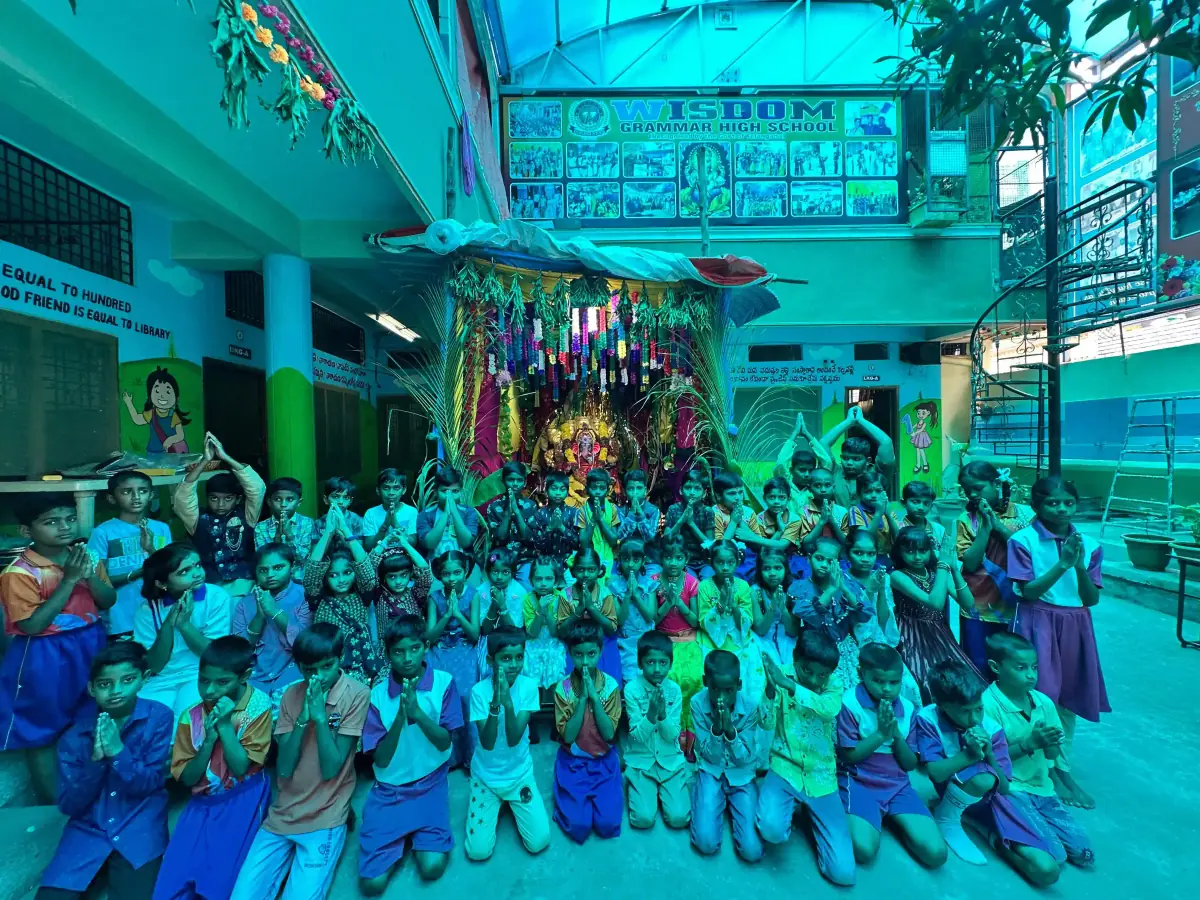 Students celebrating Ganesh Chavithi with decorations and traditional attire